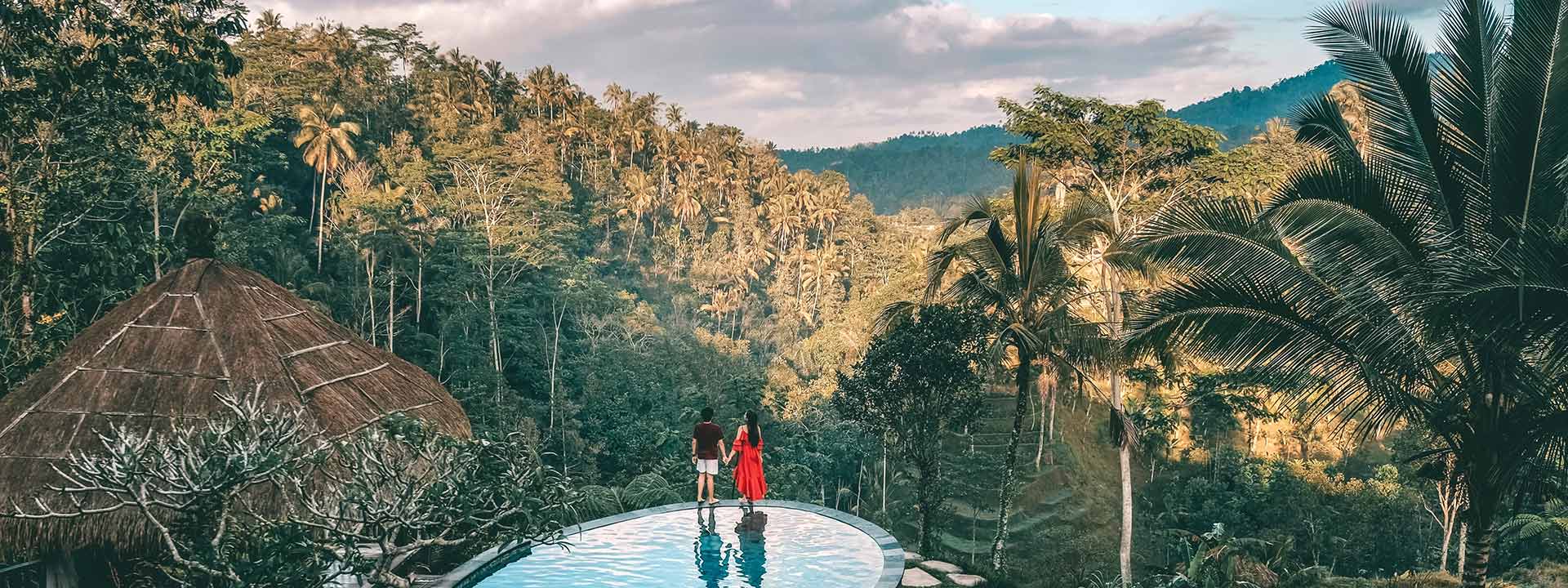 Two people enjoying the views in Bali on their trip, which they planned with Bali travel card from Visa.